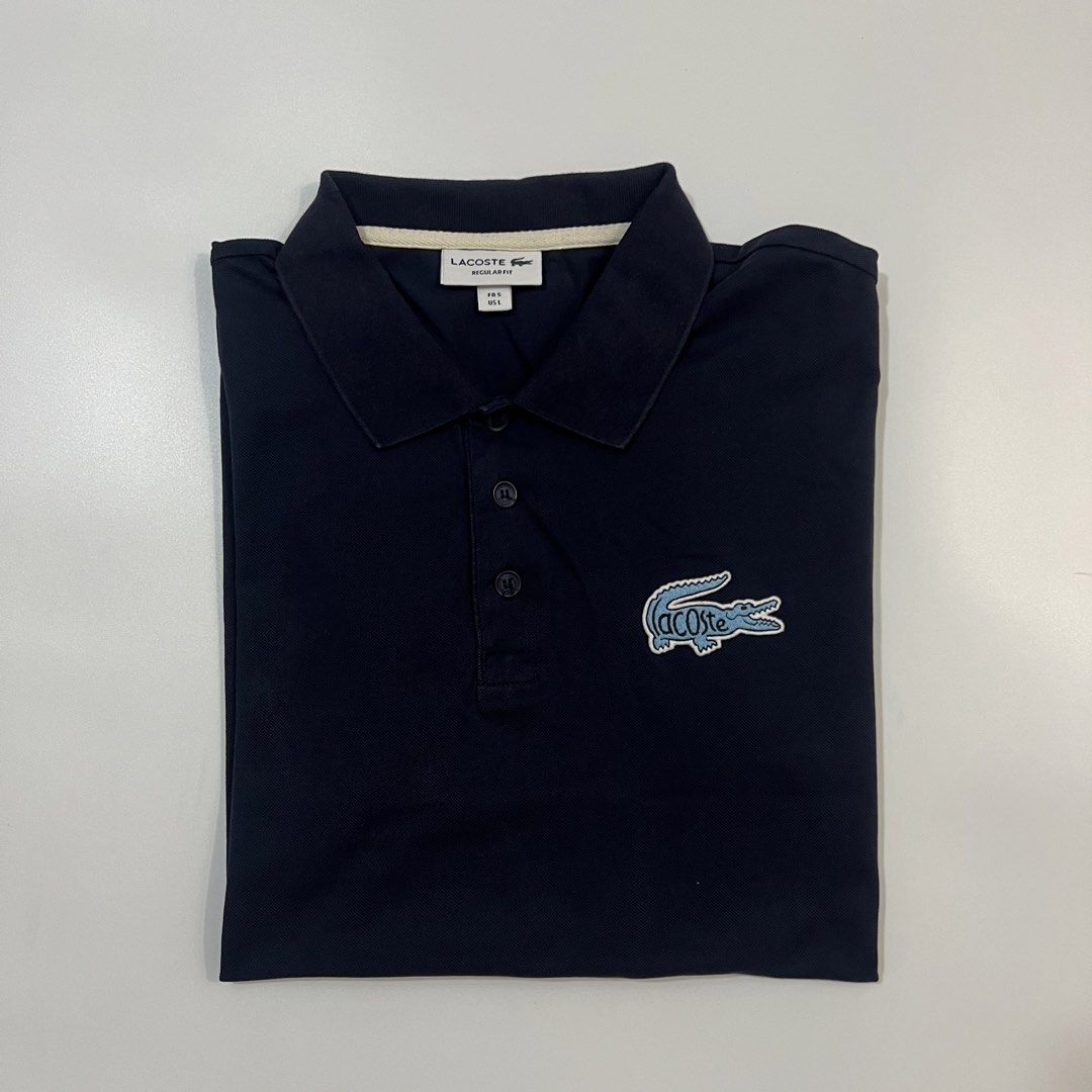 Lacoste Nave Blue (Category: Tshirts & Polo Shirts ) located in Cebu City. Submitted by ubecthrift (Listing ID 1468102977, Image 1). Description: Lacoste Navy Blue (Bit Logo) Large on tag 21 width 26 length No flaws Excellent condition Authentic 💯.