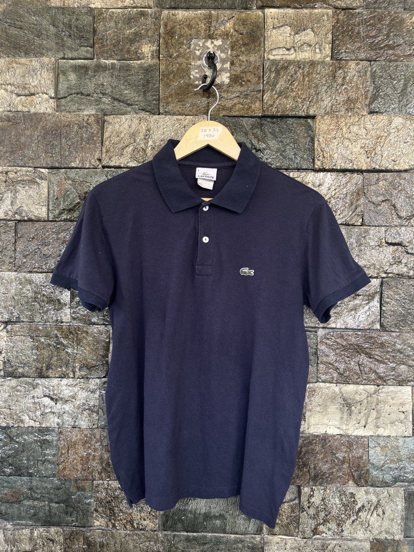 Lacoste Navy Blue Poloshirt (Category: Tshirts & Polo Shirts ) located in Cagayan de Oro. Submitted by curatedheirloomph_ (Listing ID 1468223227, Image 1). Description: 𝘿𝙞𝙢𝙚𝙣𝙨𝙞𝙤𝙣𝙨: 20x25 𝘽𝙚𝙨𝙩 𝙁𝙞𝙩: Small - Medium 𝘾𝙤𝙣𝙙𝙞𝙩𝙞𝙤𝙣 & 𝘾𝙤𝙡𝙤𝙧 𝙍𝙖𝙩𝙚: Excellent (9.5/10) 𝙄𝙨𝙨𝙪𝙚: Minimal lints 𝘼𝙪𝙩𝙝𝙚𝙣𝙩𝙞𝙘𝙞𝙩𝙮 𝘿𝙚𝙘𝙡𝙖𝙧𝙖𝙩𝙞𝙤𝙣: Authentic.