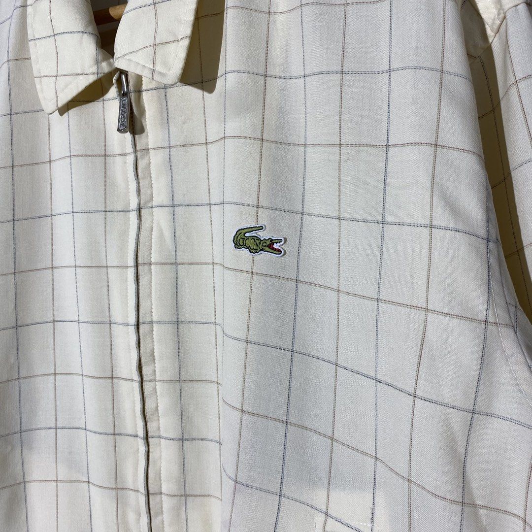 Lacoste Plaid Harrington Jacket (Category: Coats, Jackets and Outerwear) located in Andop. Submitted by rhouzze.ph24 (Listing ID 1468165640, Image 2). Description: OPEN FOR NEGOTIATION Name: Lacoste Dimensions: 23.5 by 27 Size: Medium Issue: Small ink stain in some ares, refer to the photos for the details.