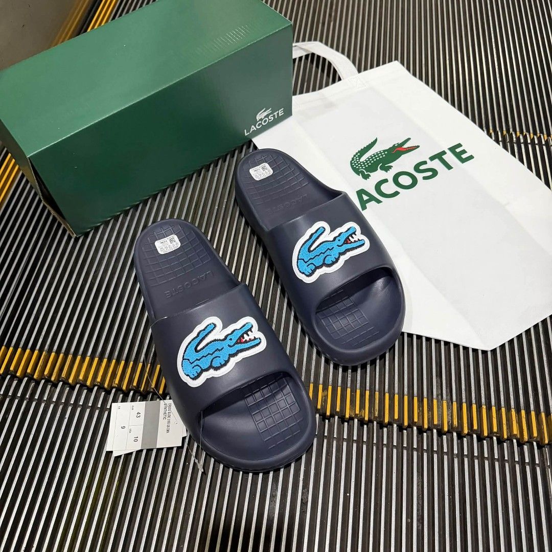 Lacoste Serve Slide (Category: Slippers & Slides) located in Manila. Submitted by ddg_s (Listing ID 1468260661, Image 3). Description: AUTHENTIC MALL PULL OUT SIZE: 41 - 45 MENS SIZE.
