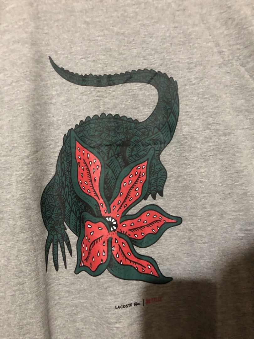 LACOSTE X NETFLIX SHIRT (Category: Tshirts & Polo Shirts ) located in Manila. Submitted by jazz_find5 (Listing ID 1468060671, Image 2). Description: LACOSTE X NETFLIX COLLAB SHIRT SIZE medium on tag 21,27 EXCELLENT ASNEW CONDITION.