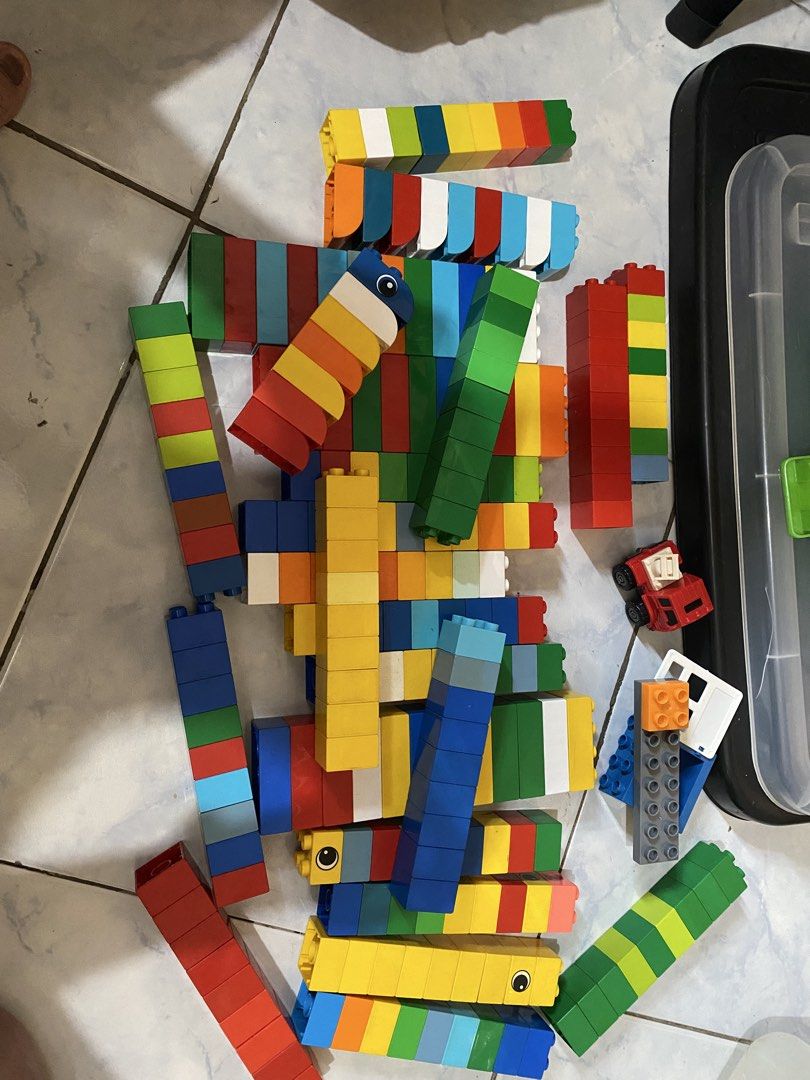 Large LEGO Duplo blocks collection with baseplates and figures (Category: Lego & Building Sets) located in Manila. Submitted by kjvillarba09992 (Listing ID 1468263061, Image 1). Description: - Bulk lot of LEGO Duplo building bricks, vehicles, animals, and figures - Features bright colors like red, blue, yellow, and green - Includes large green baseplates, road pieces, airplanes, cars, and a unique tiger head block - Ideal for toddlers to build la