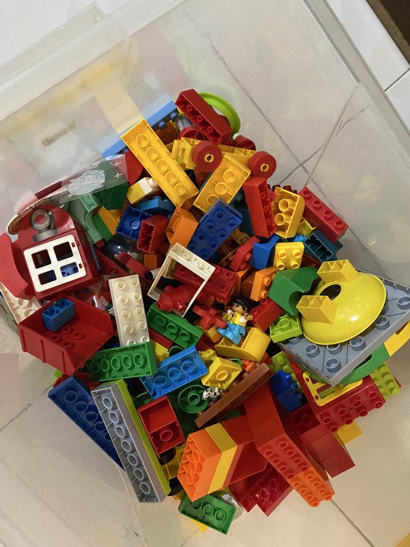 Large LEGO Duplo blocks collection with baseplates and figures (Category: Lego & Building Sets) located in Manila. Submitted by kjvillarba09992 (Listing ID 1468263061, Image 2). Description: - Bulk lot of LEGO Duplo building bricks, vehicles, animals, and figures - Features bright colors like red, blue, yellow, and green - Includes large green baseplates, road pieces, airplanes, cars, and a unique tiger head block - Ideal for toddlers to build la