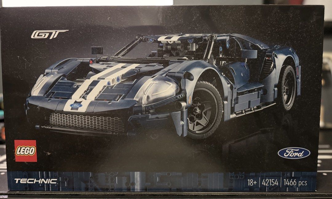 LEGO Technic Ford GT 42154 1466 pcs (Category: Lego & Building Sets) located in Taguig. Submitted by brickcollector001 (Listing ID 1468230035, Image 1). Description: - Brand new and factory-sealed building kit for adults - Features 1,466 detailed pieces, measuring 39 cm long - Recreates the iconic 2022 Ford GT with blue and white racing stripes - Includes working V6 engine with moving pistons, independent suspension, and front steering - Features