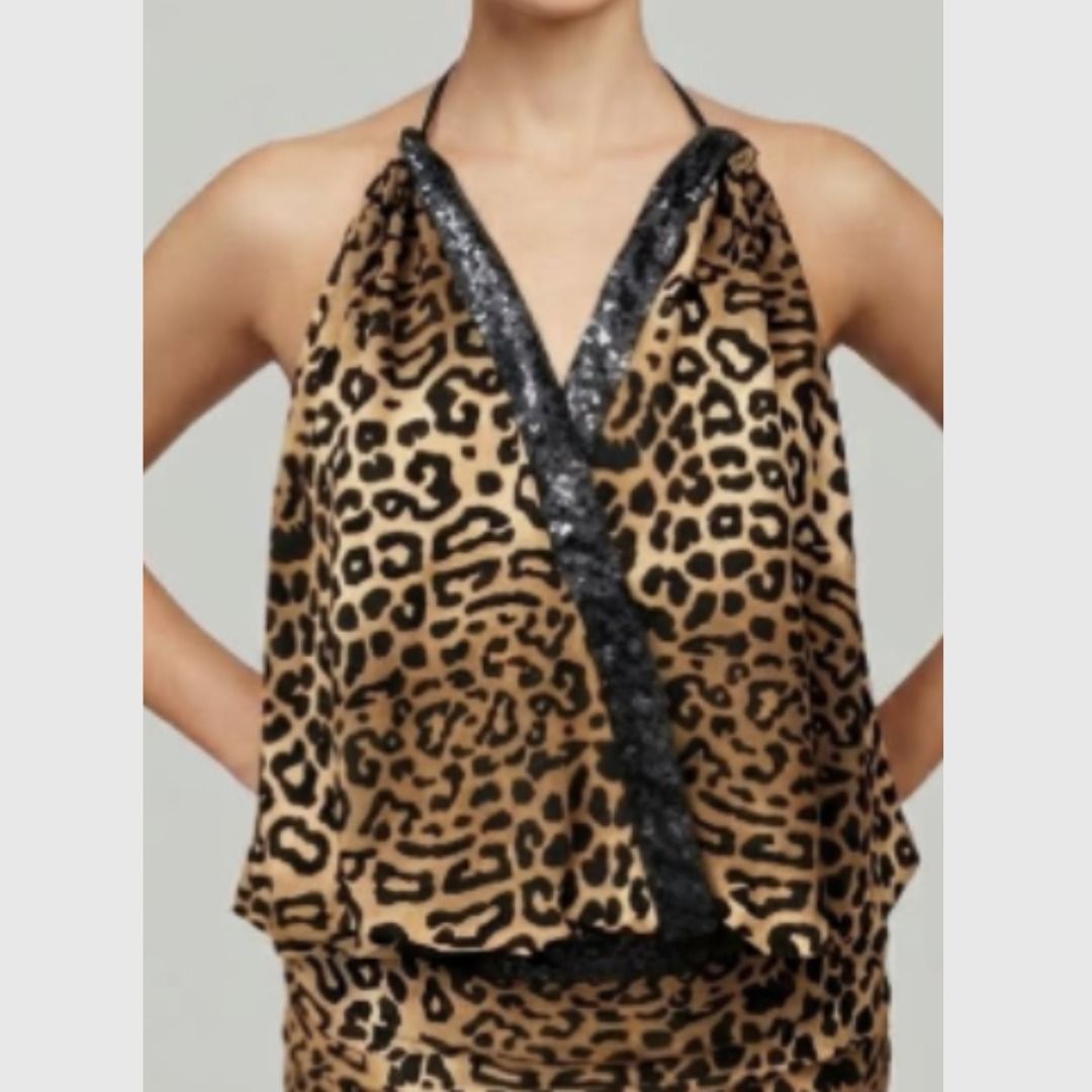 Leopard print halter top with sequin trim (Category: Sleeveless) located in Quezon City. Submitted by SustainableFashionatbp (Listing ID 1468073517, Image 2). Description: - Style: animal print halter top with black straps - Details: Sparkling black sequins along the V-neckline and waist band - Fit: Lightweight, stretchy, and comfortable for all-night wear, can fit XS-M since it's stretchy - Occasion: Perfect statement piece for parties and going