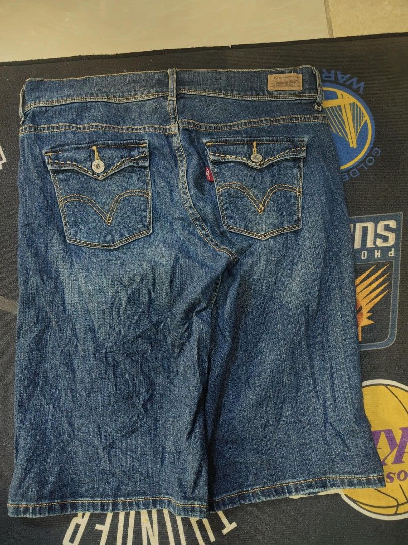 Levi's 515 Bermuda denim shorts (Category: Shorts) located in Quezon City. Submitted by andreialej28522 (Listing ID 1468061350, Image 3). Description: - Brand: Levi's (Model 515 Bermuda) - Wash: Classic medium blue - Rise: Mid-rise fit - Closure: Double-button with zipped fly - Pockets: Flapped back pockets with signature stitching - Style: Great for casual everyday wear and easy to pair with tees or tanks.