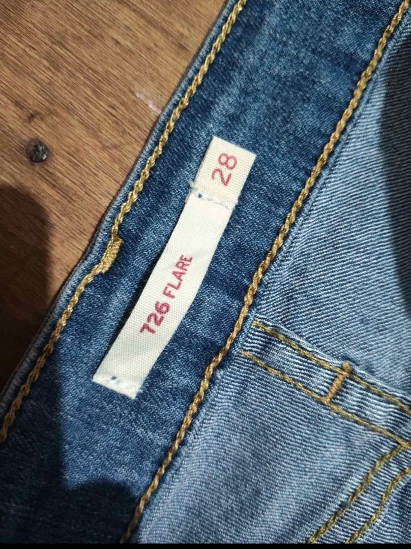 Levi's 726 Flare Jeans Size 28 (Category: Jeans) located in Manila. Submitted by sweety_skwert (Listing ID 1468080320, Image 3). Description: Levi's 726 flare jeans in medium wash denim. Mid rise style with front seam detailing and split hems at the ankles. Classic five pocket design with button and zip fly closure. Leather back patch and branded hardware. Tag size 28. 28-30 actual width 43.5 Length 9-10 inches Hem Issues dirt on last pic..