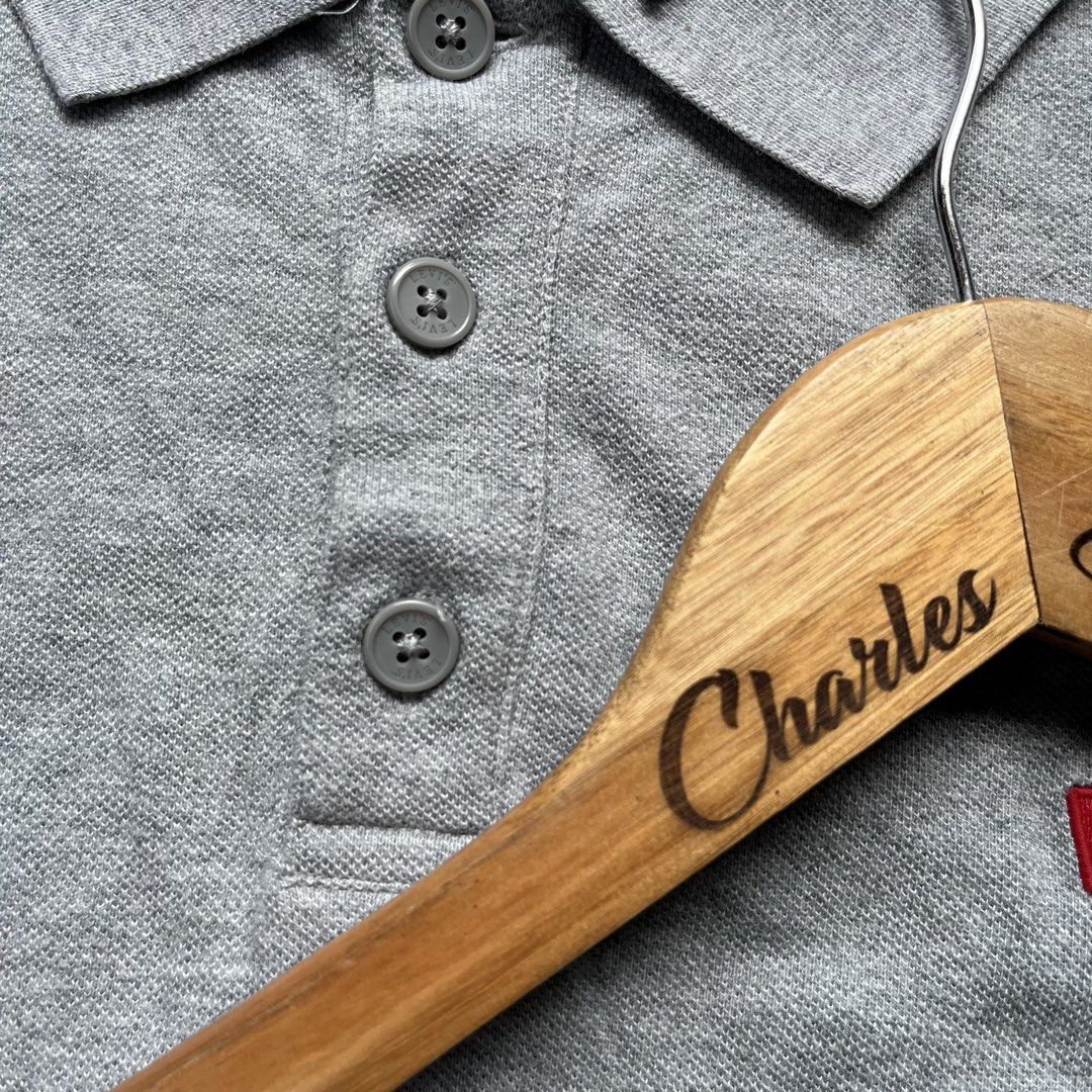 Levi's Grey Polo Shirt (Category: Tshirts & Polo Shirts ) located in Davao. Submitted by charlesole52665 (Listing ID 1468096927, Image 3). Description: - Brand: Levi's - Color: Grey - Size: XL on tag - Width: 23 inch - Length: 28 inch - Material: Classic cotton knit - Logo: Embroidered red batwing logo on left chest - Details: Three-button placket with branded buttons, ribbed cuffs, and iconic red tab on the side hem - Condition: Excellent / Pre-