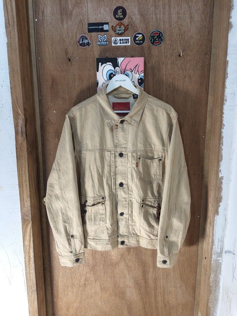 Levis RED 2021 Pleated Utility Trucker Buckled Jacket (Category: Coats, Jackets and Outerwear) located in Nasipit. Submitted by zaynzdrip (Listing ID 1468083448, Image 1). Description: Lebays RED 2021 Pleated Utility Trucker Buckled Jacket Measurements: 22 width 27 length 26 sleeve length Medium on Tag Condition Very Excellent Color: Beige Blank Red Tab With back cinch strap and adjustable buttons ₱3,500 only 📍Mindanao, 8602 For assurance, visit