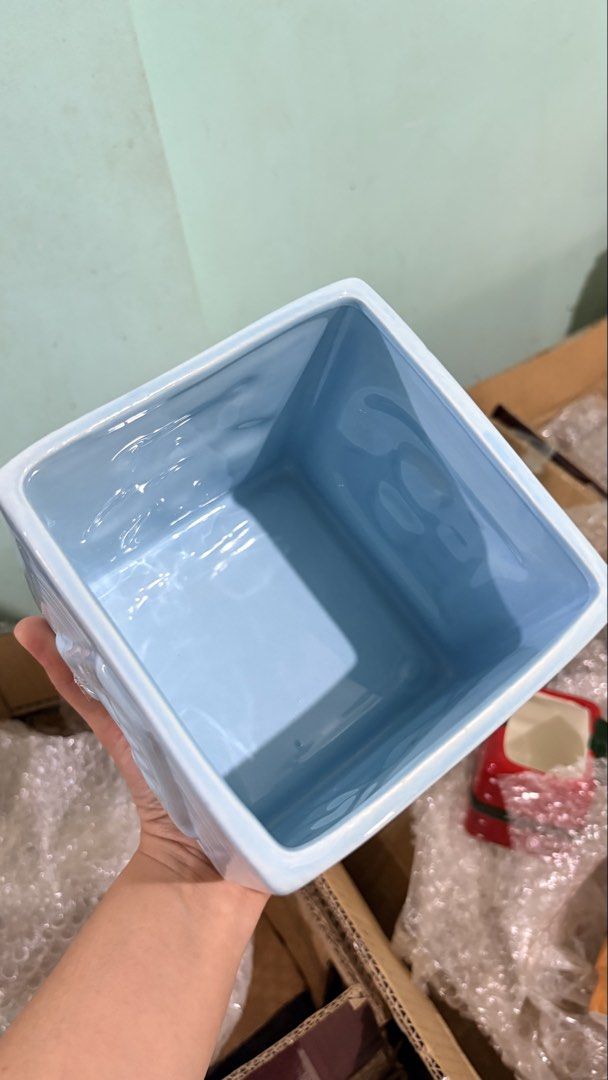 Light Blue Ceramic Baby Block planter/holder (Category: Other Home Decor) located in Quezon City. Submitted by ar.sulit.finds (Listing ID 1468257928, Image 3). Description: - Material: High-quality ceramic with a glossy finish - Design: Light blue block planter with a raised letter B on one side and a teddy bear on the other - Texture: Stylish ribbed borders with an open top and hollow interior - Versatility: Ideal as a small plant pot, succulent