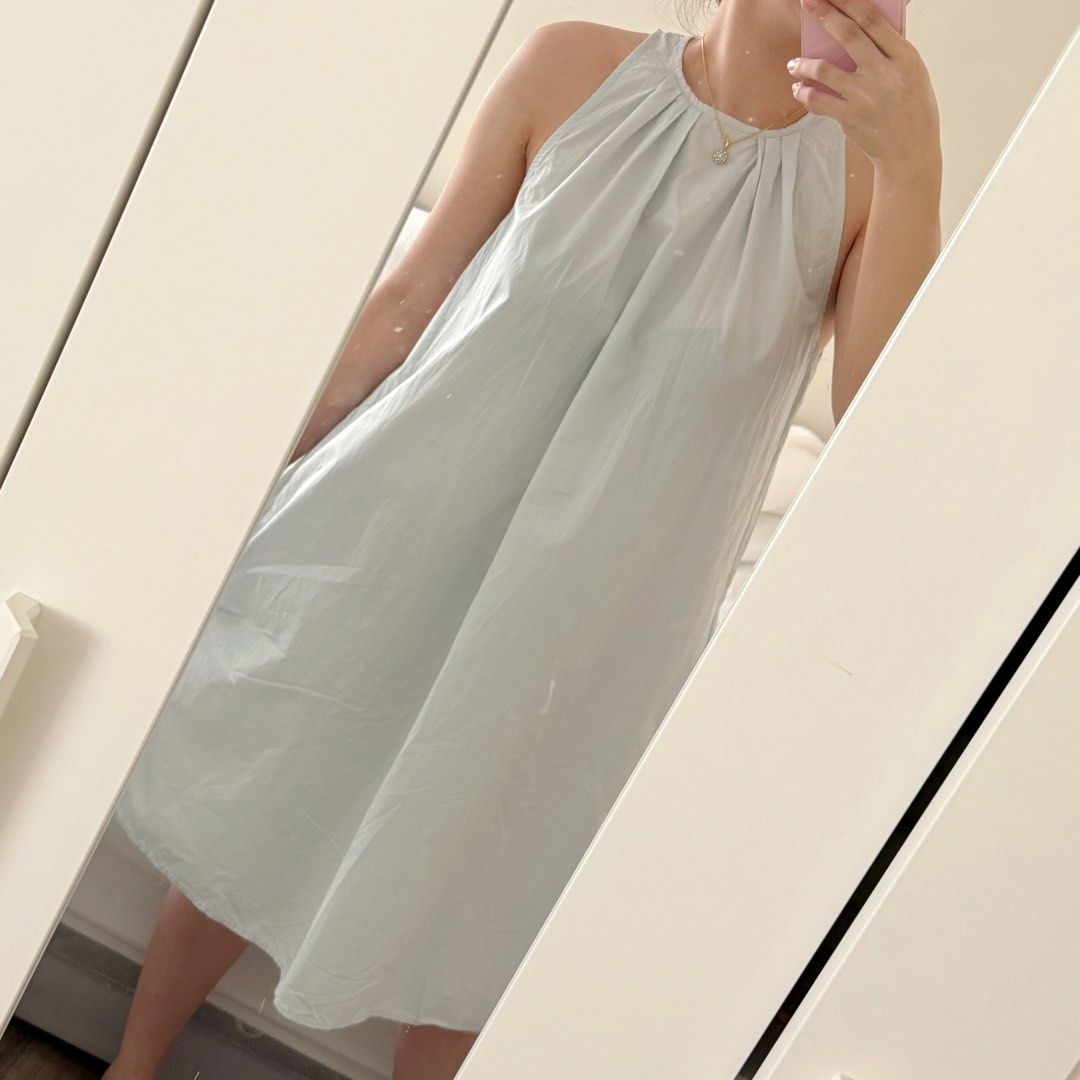 Light blue halter neck midi dress with pockets (Category: Dresses) located in Marikina City. Submitted by lovegoeson (Listing ID 1468068762, Image 3). Description: - Color: Light blue - Style: Halter neckline with back button closure and pleated collar - Length: Mid-calf midi dress with a relaxed, flowy silhouette - Features: Practical side pockets - Condition: like new, once used - Best for: Easy, casual warm-weather styling.