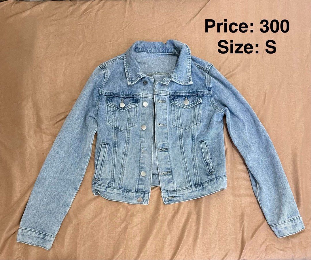 Light wash cropped denim jacket size S (Category: Coats, Jackets and Outerwear) located in Makati City. Submitted by shanineee (Listing ID 1468118611, Image 1). Description: - Size: S - Wash: Light denim - Design: Button-up front with classic collar - Pockets: Chest pockets and side pockets - Perfect layering piece for casual outfits - Pit-to-pit and length measurements available upon request.