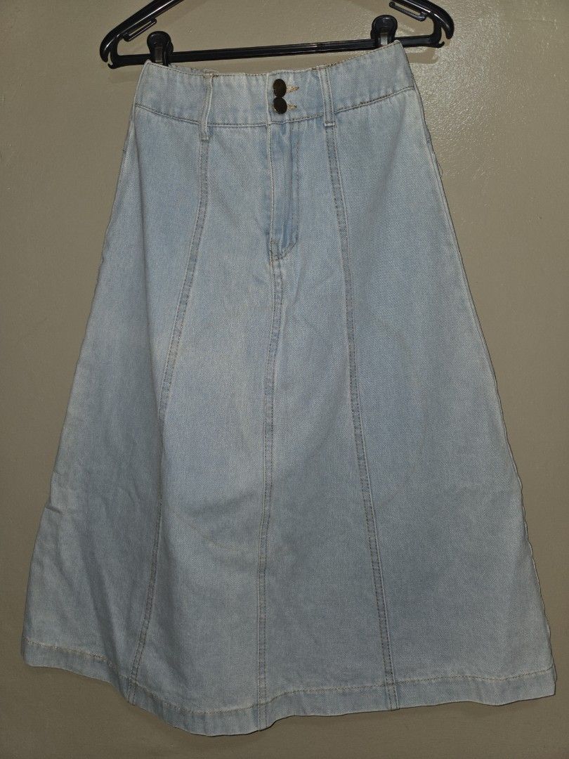 Light wash denim skirt with front panels and button closure (Category: Skirts) located in Quezon City. Submitted by klarebear15 (Listing ID 1468240078, Image 1). Description: - Color: Light blue - Style: High waist, midi/knee length, casual - Closure: Two front buttons - Comfort: Elastic waistband detail at the back for a flexible fit - Details: Vertical panel stitching.