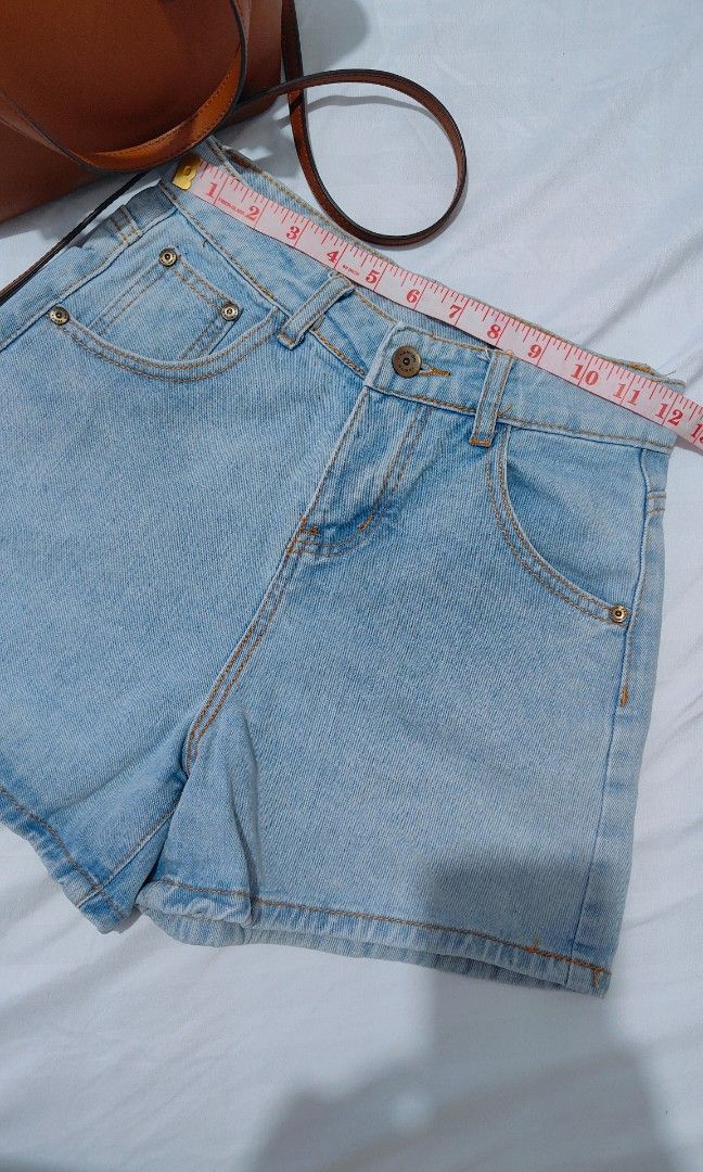 Light wash high waisted denim shorts (Category: Shorts) located in Bacolor. Submitted by annjjjjj (Listing ID 1468083054, Image 2). Description: - Style: Light wash, high-waisted denim shorts - Details: Classic metal button fly with orange contrast stitching - Pockets: Four-pocket setup plus a small front coin pocket - Fit: Medium length with clean edges - Versatility: Casual everyday piece, easy to style with basic tees and tops.