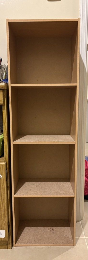 Light Wood 4-Tier Open Bookshelf Storage Unit (Category: Shelves, Cabinets & Racks) located in Manila. Submitted by loislane112233 (Listing ID 1468204818, Image 1). Description: - Type: Tall wooden bookcase - Finish: Light wood laminate - Storage: 4 spacious open compartments - Material: Heavy particle board construction - Design: Clean lines, simple vertical setup that fits neatly against any wall - Ideal for: Organizing books, binders, and disp