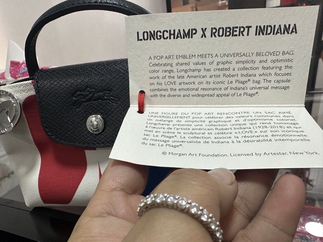 Limited Edition Longchamp pouch original (Category: Luxury Bags & Wallets) located in Quezon City. Submitted by dazzlejeweller (Listing ID 1468082537, Image 2). Description: Original longchamp mini pouch for only 1850 pesos only. Can ship via lalamove or meet up at Gateway mall Araneta center Cubao. A limited-edition Longchamp Robert Indiana Le Pliage Pouch. This highly popular 2023 capsule collection paid tribute to the late American pop artist 