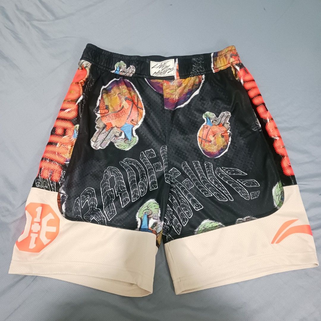 Li-Ning Badfive Shorts (Size L) (Category: Shorts) located in Imus. Submitted by kctrey (Listing ID 1468130772, Image 1). Description: - Brand: Li-Ning Badfive - Size: L (175/80A) - Condition: Brand new with original tags attached, never worn - Design: Bold all-over graphic print in a black and tan colorway - Details: Large Badfive branding down the front and Li-Ning logo on the hem - Versatility: Great for basketball court sessions or casual str