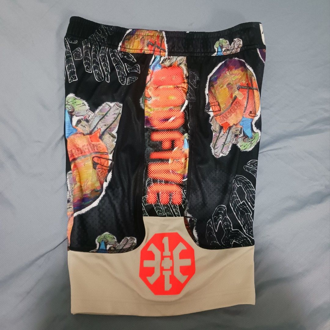 Li-Ning Badfive Shorts (Size L) (Category: Shorts) located in Imus. Submitted by kctrey (Listing ID 1468130772, Image 2). Description: - Brand: Li-Ning Badfive - Size: L (175/80A) - Condition: Brand new with original tags attached, never worn - Design: Bold all-over graphic print in a black and tan colorway - Details: Large Badfive branding down the front and Li-Ning logo on the hem - Versatility: Great for basketball court sessions or casual str