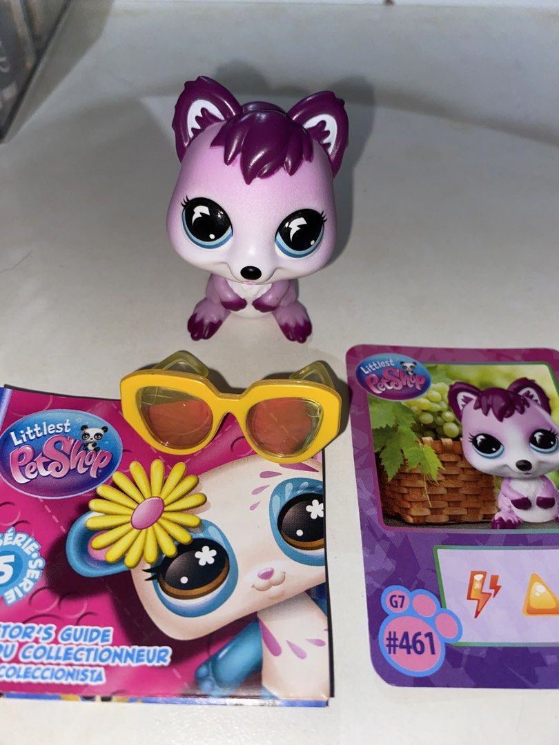 Littlest Pet Shop G7 #461 (Category: Figurines & Statues) located in Makati City. Submitted by yourruth (Listing ID 1468219425, Image 2). Description: - Item: Littlest Pet Shop (LPS) Generation 7 - Fox #461 - Appearance: Purple and white with striking big blue eyes - Inclusions: Yellow translucent sunglasses, collector card, and series 5 guide booklet - Condition: Clean paint, well-maintained, and in great shape - Perfect for LPS collectors and f
