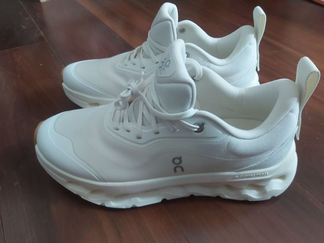 Loewe x On Cloudtilt White Sneakers (Category: Sneakers) located in Taguig. Submitted by wongmengwei91765 (Listing ID 1468140879, Image 2). Description: - Brand: Loewe x On Cloudtilt collaboration - Color: All-white (Clean, versatile aesthetic) - Sole: Trendy chunky sculptural design for maximum comfort - Details: Dual branding on tongue, insole, and heel pull tab - Hardware: Lace-up closure with stylish metallic eyelets - Condition: Brand new / 