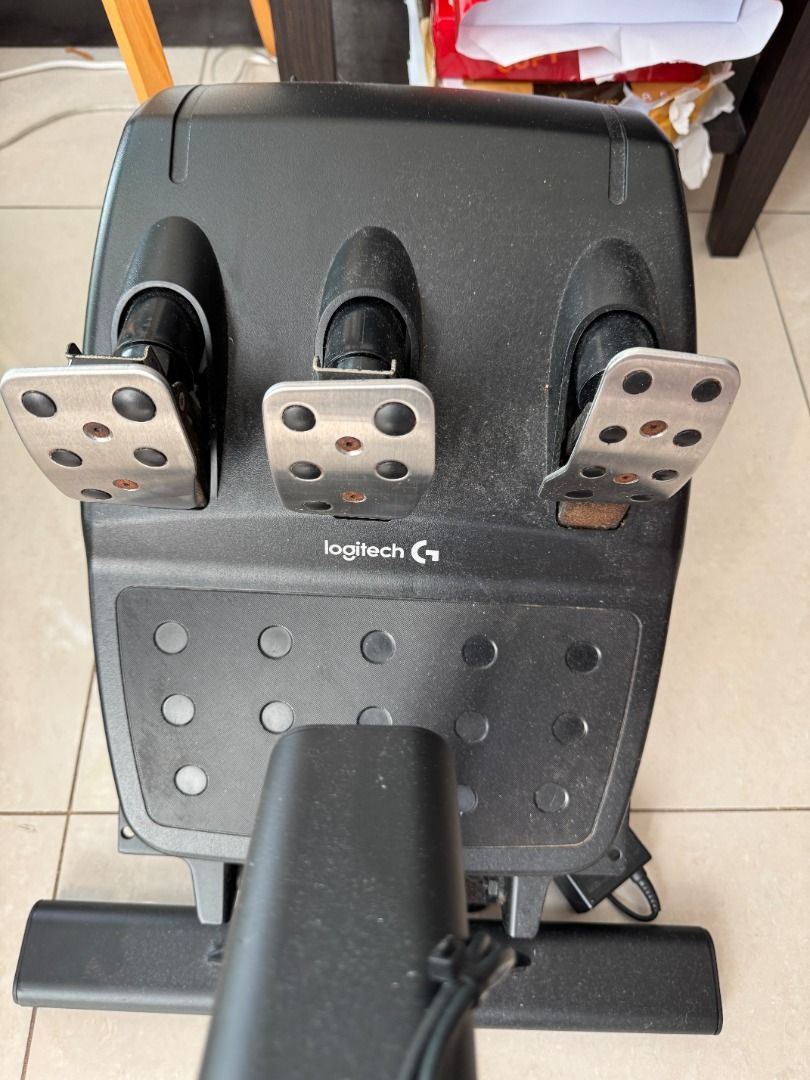 Logitech G29 Driving Force Racing Wheel and Pedals with Playseat Evolution (Category: Controllers) located in Manila. Submitted by hashdash (Listing ID 1468177648, Image 3). Description: - Complete Logitech G29 racing simulator rig - Includes steering wheel unit with metal paddle shifters and leather wrap - 3-pedal floor set (clutch, brake, gas) - Playseat Evolution comfortable blue suede racing chair .