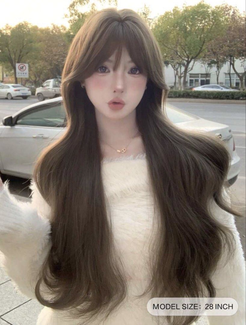 Long Brown Wavy Wig with Bangs 28 Inch (Category: Hair Accessories) located in Batangas. Submitted by melocollects (Listing ID 1468139422, Image 1). Description: - Style: Long wavy wig with bangs - Color: Natural brown - Length: 28 inches - Comfort: Air-permeable inner net with fully adjustable straps - Realism: Simulated scalp design for a natural-looking part - Freebie: Includes a black wig cap for easy wear.