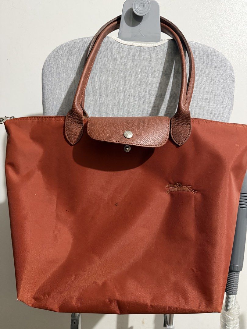 Longchamp Le Pliage Large Tote Bag (Cognac) (Category: Tote Bags) located in Manila. Submitted by pjdvd (Listing ID 1468164883, Image 1). Description: Guaranteed authentic. Bought from Rustans. With paperbag..