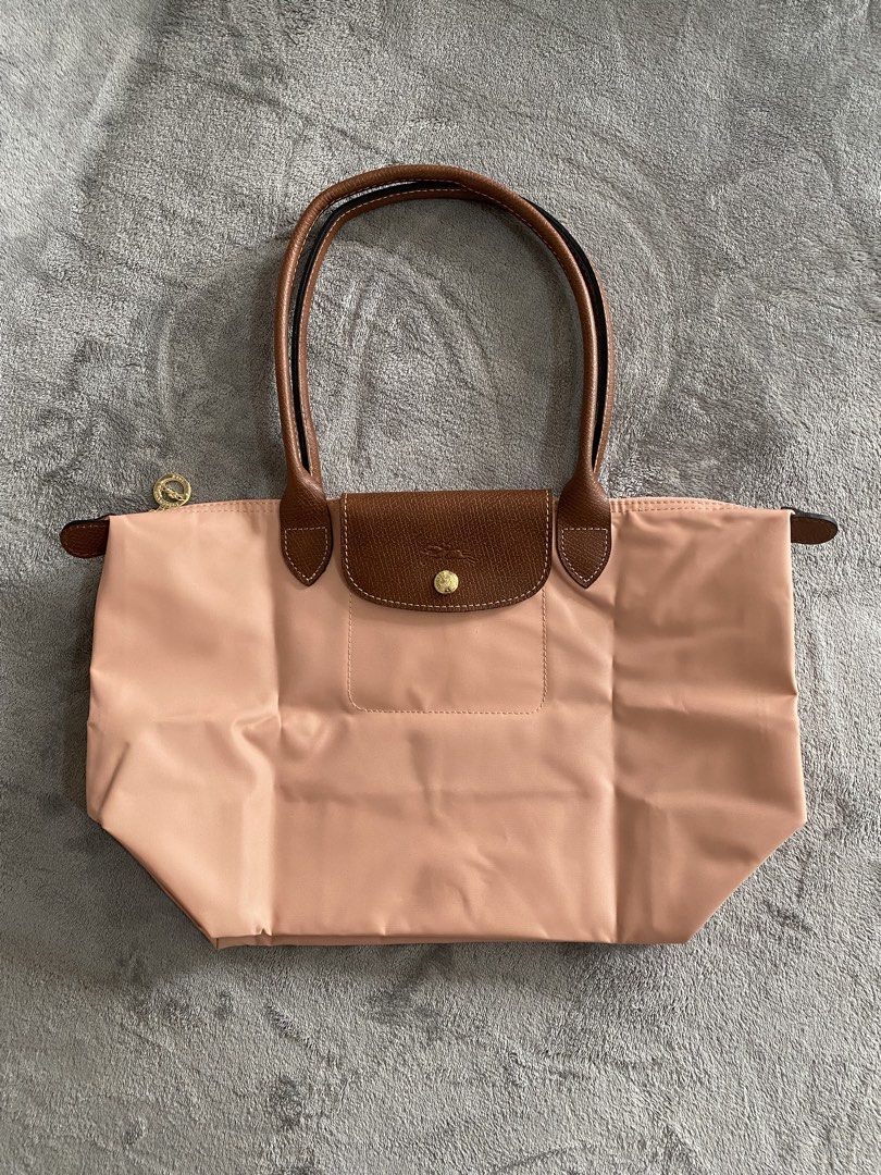 Longchamp Sakura Pink Medium Long Handle (Category: Tote Bags) located in Cagayan de Oro. Submitted by shopforlesshere (Listing ID 1468258867, Image 1). Description: Longchamp Sakura Pink Medium Long Handle NGA.