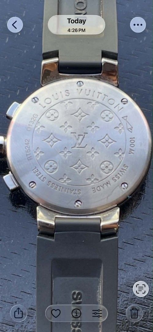 Louis Vuitton Cup Chronograph Watch Black Rubber Strap (Category: Luxury Watches) located in Manila. Submitted by zackthrift16 (Listing ID 1468208562, Image 2). Description: - Model: Louis Vuitton Cup Chronograph - Dial: Blue with white numbers, sub-dials, and date window - Strap: Black rubber with embossed LV monogram pattern - Case Back: Stainless steel with serial numbers RT5242 and 0132G, plus Swiss Made markings - Movement: Chronograph with 