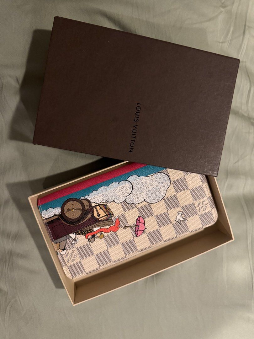 Louis Vuitton Damier Azur Zippy Wallet Animation (authentic) (Category: Wallets & Card holders) located in Pasig City. Submitted by sharonjab (Listing ID 1468143976, Image 1). Description: - Authentic Louis Vuitton Zippy Wallet - Damier Azur canvas with rare limited edition animation print - Vibrant pink interior lining with multiple card slots and zippered coin compartment - Secure zip-around closure with gold-tone hardware - Clean inside and ou