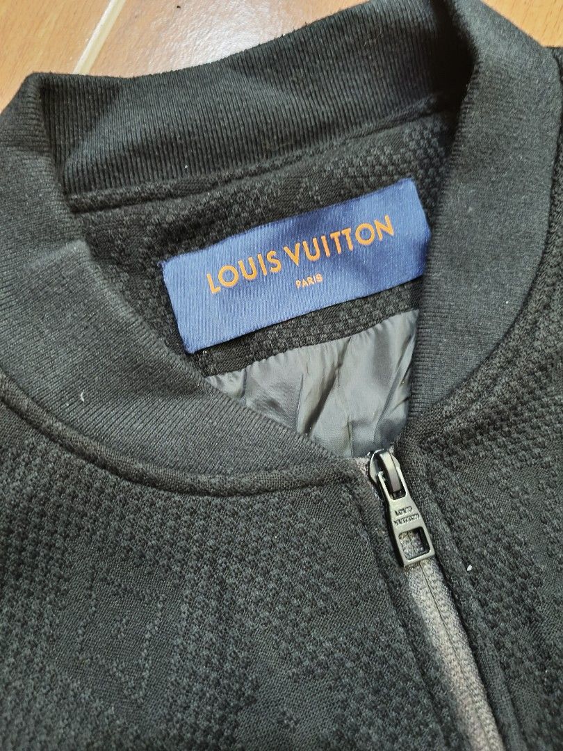 Louis Vuitton Monogram Black Bomber Jacket Size 48 (Category: Coats, Jackets and Outerwear) located in Manila. Submitted by juancho.ac (Listing ID 1468140530, Image 2). Description: - Brand: Louis Vuitton - Item: Black Bomber Jacket - Size: 48 - Pattern: All-over monogram on textured fabric - Details: Zip-up front with branded hardware, ribbed cuffs, collar, and hem - Interior: Fully lined with original tag labels intact - Condition: Pristine, re