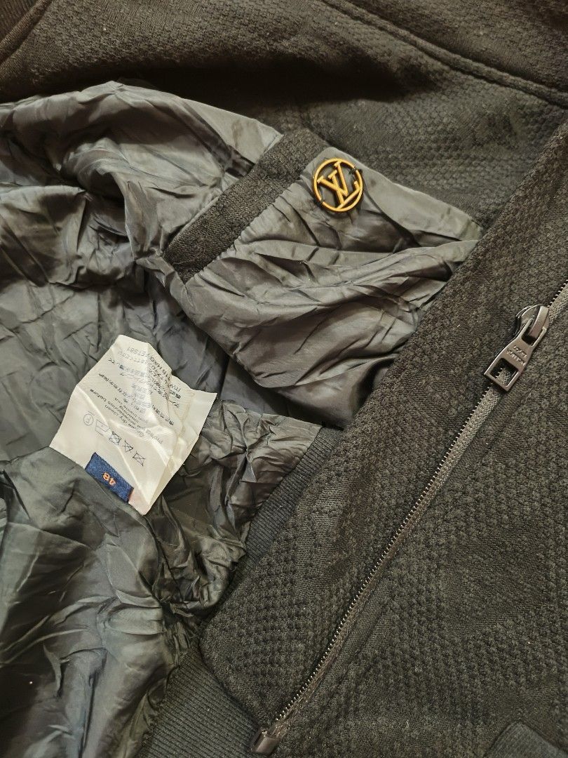 Louis Vuitton Monogram Black Bomber Jacket Size 48 (Category: Coats, Jackets and Outerwear) located in Manila. Submitted by juancho.ac (Listing ID 1468140530, Image 3). Description: - Brand: Louis Vuitton - Item: Black Bomber Jacket - Size: 48 - Pattern: All-over monogram on textured fabric - Details: Zip-up front with branded hardware, ribbed cuffs, collar, and hem - Interior: Fully lined with original tag labels intact - Condition: Pristine, re