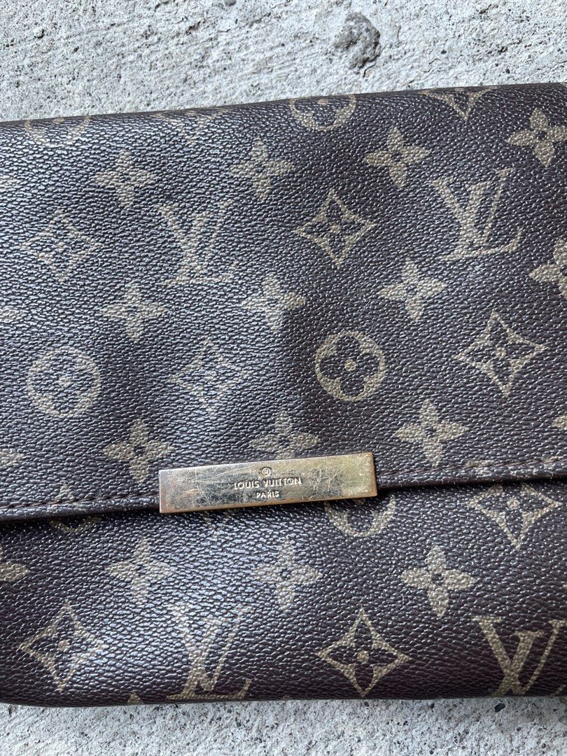 Louis Vuitton Monogram Canvas Crossbody Bag with Strap (Category: Luxury Bags & Wallets) located in Siniloan. Submitted by rethr1ft (Listing ID 1468085701, Image 3). Description: - Authentic Louis Vuitton crossbody bag in classic brown monogram canvas - Adjustable leather shoulder strap with gold-tone hardware - Secure front flap closure with engraved metal plaque - Condition: Visible wear along corner edges and light scratching on the metal plaq