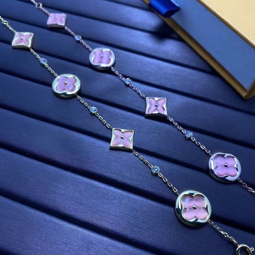 Louis Vuitton Monogram Flower Pink Crystal Bracelet (Category: Bracelets) located in Malabon City. Submitted by ojaswibent53454 (Listing ID 1468137316, Image 3). Description: - Authentic Louis Vuitton gold-tone chain bracelet - Features charming pink mother-of-pearl/resin flower motifs and alternating round crystals - Includes a signature mini LV charm near the clasp - Comes complete with the iconic yellow Louis Vuitton gift box - Versatile state