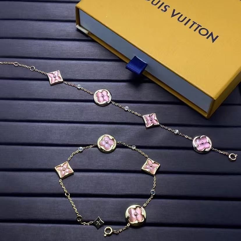 Louis Vuitton Monogram Flower Pink Crystal Bracelet (Category: Bracelets) located in Malabon City. Submitted by ojaswibent53454 (Listing ID 1468137316, Image 1). Description: - Authentic Louis Vuitton gold-tone chain bracelet - Features charming pink mother-of-pearl/resin flower motifs and alternating round crystals - Includes a signature mini LV charm near the clasp - Comes complete with the iconic yellow Louis Vuitton gift box - Versatile state