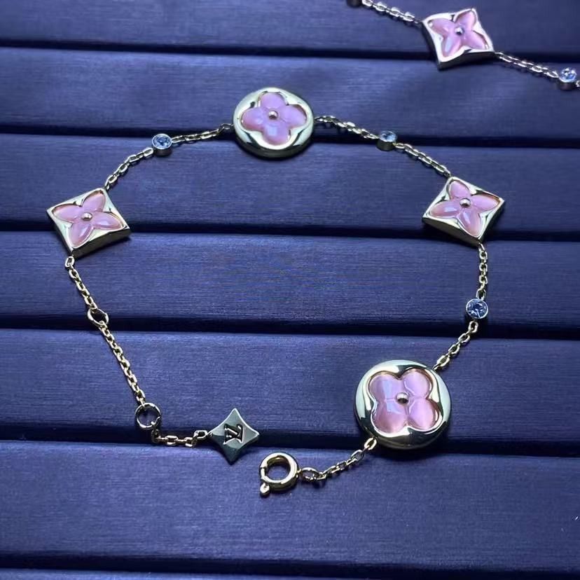 Louis Vuitton Monogram Flower Pink Crystal Bracelet (Category: Bracelets) located in Malabon City. Submitted by ojaswibent53454 (Listing ID 1468137316, Image 2). Description: - Authentic Louis Vuitton gold-tone chain bracelet - Features charming pink mother-of-pearl/resin flower motifs and alternating round crystals - Includes a signature mini LV charm near the clasp - Comes complete with the iconic yellow Louis Vuitton gift box - Versatile state