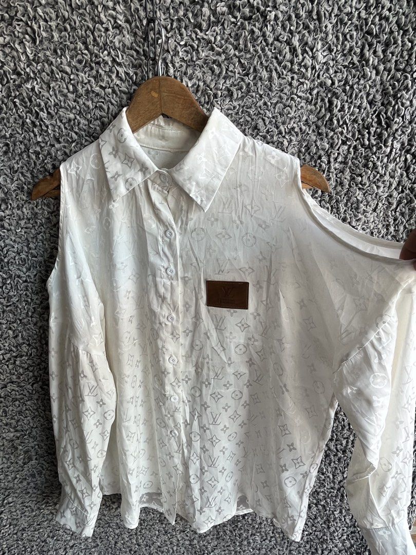 Louis Vuitton monogram pattern | Size M to L (Category: Shirts) located in General Trias. Submitted by zrchustle.604 (Listing ID 1468143059, Image 3). Description: Louis Vuitton monogram pattern, a pointed collar, cold-shoulder or cut-out sleeveless arm openings with long sleeves attached, and a brown leather pocket patch on the chest. OFF only.