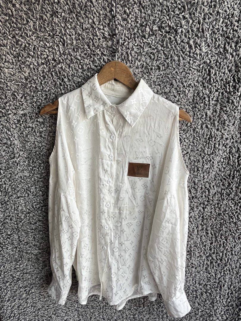 Louis Vuitton monogram pattern | Size M to L (Category: Shirts) located in General Trias. Submitted by zrchustle.604 (Listing ID 1468143059, Image 2). Description: Louis Vuitton monogram pattern, a pointed collar, cold-shoulder or cut-out sleeveless arm openings with long sleeves attached, and a brown leather pocket patch on the chest. OFF only.