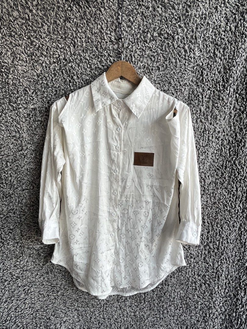 Louis Vuitton monogram pattern | Size M to L (Category: Shirts) located in General Trias. Submitted by zrchustle.604 (Listing ID 1468143059, Image 1). Description: Louis Vuitton monogram pattern, a pointed collar, cold-shoulder or cut-out sleeveless arm openings with long sleeves attached, and a brown leather pocket patch on the chest. OFF only.