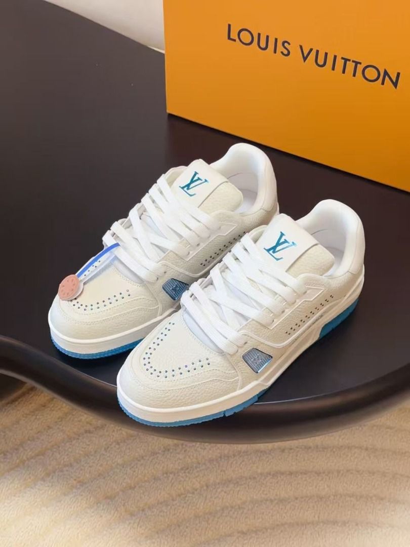 Louis Vuitton Trainer White Blue (Category: Sneakers) located in Manila. Submitted by kevingarci93240 (Listing ID 1468117816, Image 3). Description: - Brand: Louis Vuitton Trainers - Colorway: White and Blue - Material: Premium grained leather upper with side mesh panel - Details: Signature LV initials on tongue and side, embroidered script LV signature - Sole: Bright blue rubber outsole with Monogram flower details - Inclusion: Original orange s