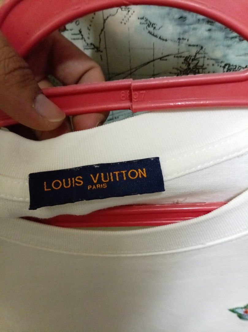 Louis Vuitton White T-Shirt Size S (Category: Shirts) located in Baguio. Submitted by jnjayceelbrn (Listing ID 1468172888, Image 3). Description: - Brand: Louis Vuitton - Item: White Crewneck T-Shirt - Size: Small (S tag attached) - Design: Colorful embroidered graphics on the front chest and statement design with signature script lettering on the back - Material: Premium cotton, relaxed fit - Origin: Made in Italy.