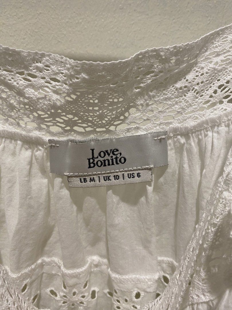 Love Bonito White Eyelet Cami Top (Category: Sleeveless) located in Davao. Submitted by decluttering.dvo (Listing ID 1468089446, Image 2). Description: - Brand: Love, Bonito - Style: White eyelet camisole with button-down front - Details: Delicate lace trim and scalloped hem - Size: UK 10 / US 6 (LB Medium) - Condition: Clean, great for warm weather - Versatile: Easy to pair with denim shorts or skirts.