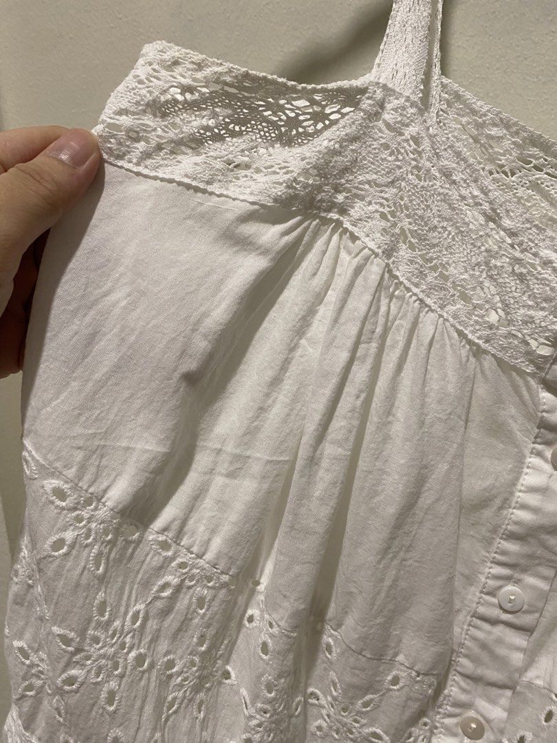 Love Bonito White Eyelet Cami Top (Category: Sleeveless) located in Davao. Submitted by decluttering.dvo (Listing ID 1468089446, Image 3). Description: - Brand: Love, Bonito - Style: White eyelet camisole with button-down front - Details: Delicate lace trim and scalloped hem - Size: UK 10 / US 6 (LB Medium) - Condition: Clean, great for warm weather - Versatile: Easy to pair with denim shorts or skirts.