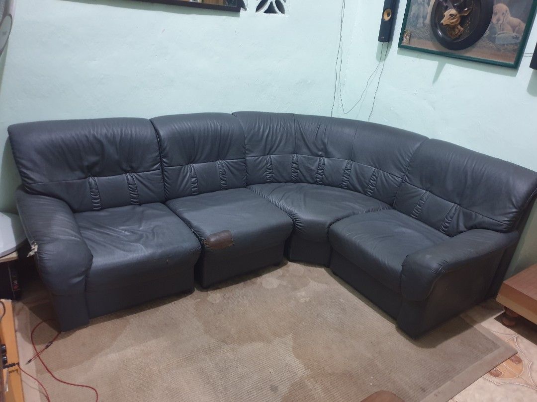 L-shaped sectional sofa Japan (Category: Sofas) located in Dasmarinas. Submitted by mysticfalcon.b6bfec (Listing ID 1468073714, Image 1). Description: - Large dark grey sectional sofa with flexible modular layout - Deep cushions and high backrests for ultimate comfort - Solid and sturdy internal frame - Honest condition: visible wear on left armrest and middle cushion, plus one patch repair - Perfect budget-friendly option for your living room - 