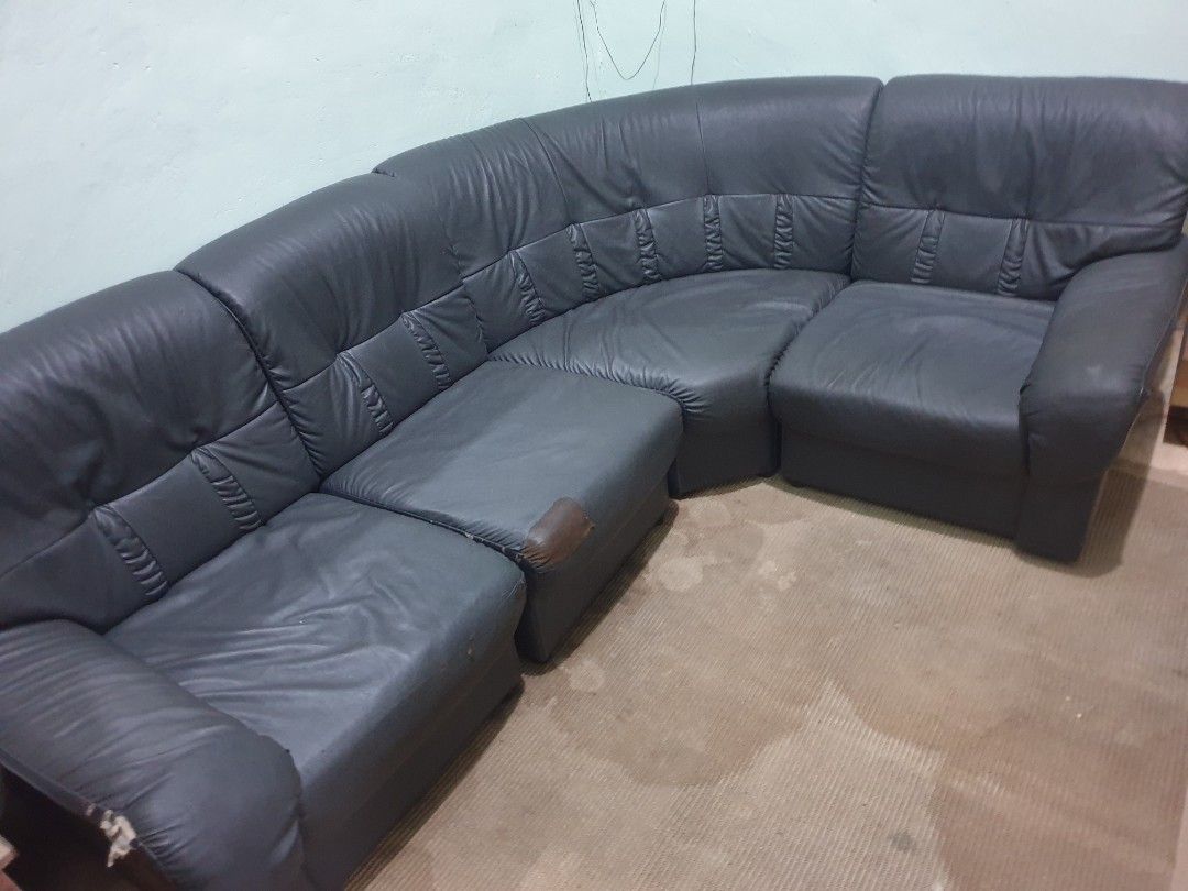 L-shaped sectional sofa Japan (Category: Sofas) located in Dasmarinas. Submitted by mysticfalcon.b6bfec (Listing ID 1468073714, Image 2). Description: - Large dark grey sectional sofa with flexible modular layout - Deep cushions and high backrests for ultimate comfort - Solid and sturdy internal frame - Honest condition: visible wear on left armrest and middle cushion, plus one patch repair - Perfect budget-friendly option for your living room - 