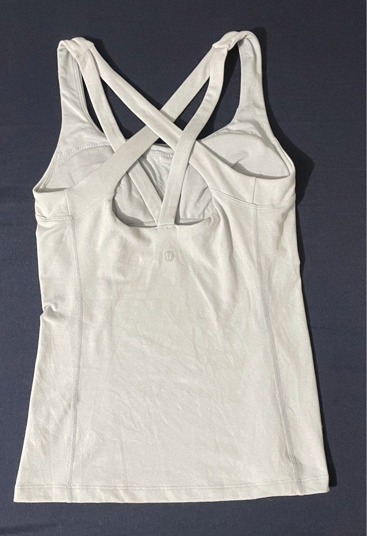 Lululemon athletic tank top with a cross-strap back design — dot 2 (Category: Activewear) located in Manila. Submitted by maefinds.ph (Listing ID 1468197238, Image 2). Description: ✨In excellent condition ✨Dot 2 ✨Padded, with pad slots ✨Intact logo Actual color: Light gray (Color may vary due to lighting) PM for more details Price is slightly negotiable .