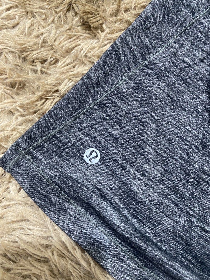 Lululemon Athletica Layered Tank Top Size 6 (Category: Sleeveless) located in Cagayan de Oro. Submitted by sepamorash53558 (Listing ID 1468263789, Image 3). Description: - Brand: Lululemon - Size: 6 (tag attached) - Color: Grey heather and black - Design: Built-in bra with a trendy strappy back - Material: Lightweight and breathable fabric - Details: Classic white Lululemon logo printed near the bottom hem - Condition: Clean, well-kept athletic w