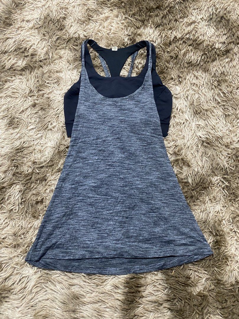 Lululemon Athletica Layered Tank Top Size 6 (Category: Sleeveless) located in Cagayan de Oro. Submitted by sepamorash53558 (Listing ID 1468263789, Image 1). Description: - Brand: Lululemon - Size: 6 (tag attached) - Color: Grey heather and black - Design: Built-in bra with a trendy strappy back - Material: Lightweight and breathable fabric - Details: Classic white Lululemon logo printed near the bottom hem - Condition: Clean, well-kept athletic w
