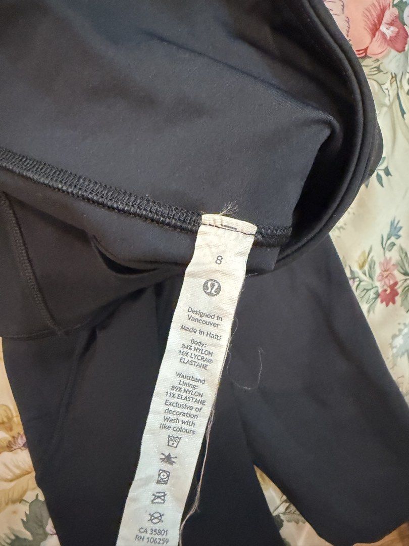 Lululemon Black Leggings Size 8 (Category: Activewear) located in Manila. Submitted by bellafleur (Listing ID 1468195977, Image 3). Description: - Brand: Lululemon - Color: Classic Black - Size: 8 - Material: Premium nylon and lycra blend (super stretchy and comfy) - Features: Convenient side pockets on both thighs and signature Lulu logo on the lower back leg - Condition: Excellent / Wash instructions on inner tag - Best for: Workouts, running, 