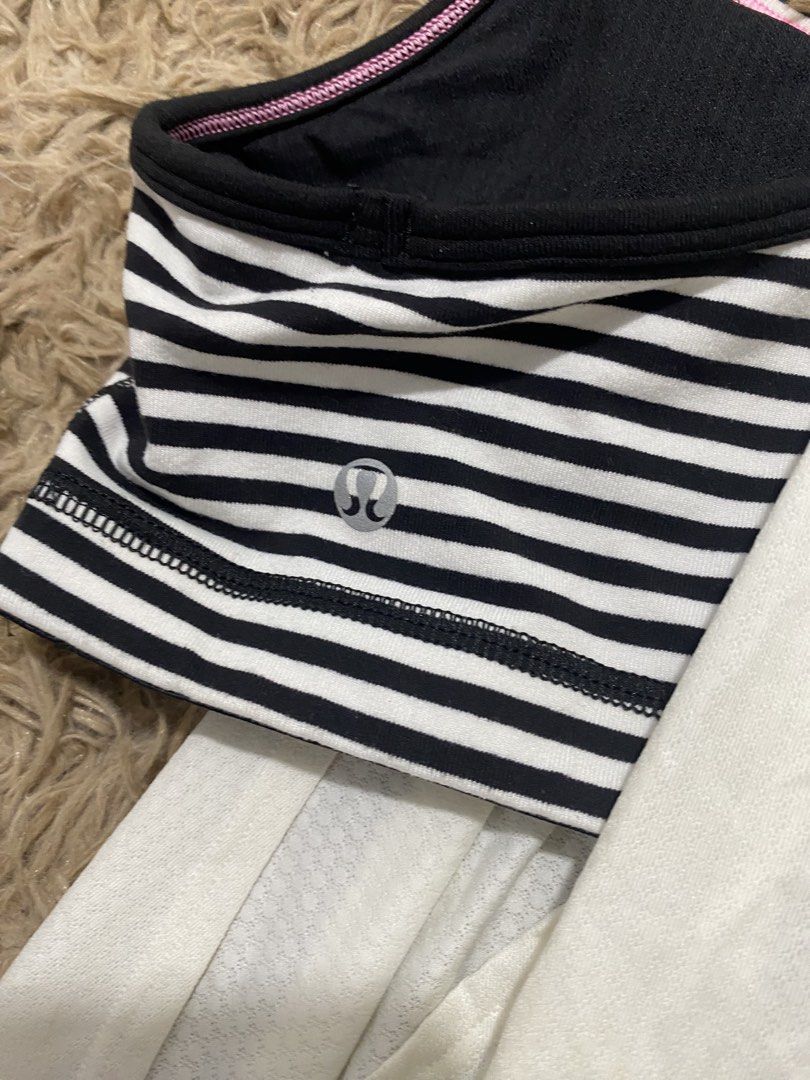 Lululemon Black White Striped Tank Top Size 8 (Category: Sleeveless) located in Cagayan de Oro. Submitted by sepamorash53558 (Listing ID 1468264304, Image 3). Description: - Brand: Lululemon - Style: Athletic tank top with built-in black and white striped bra - Features: Racerback design, pink trim details, and iconic silver omega logo - Size: 8 - Condition: Pre-loved with some noticeable light stains on the white fabric section.